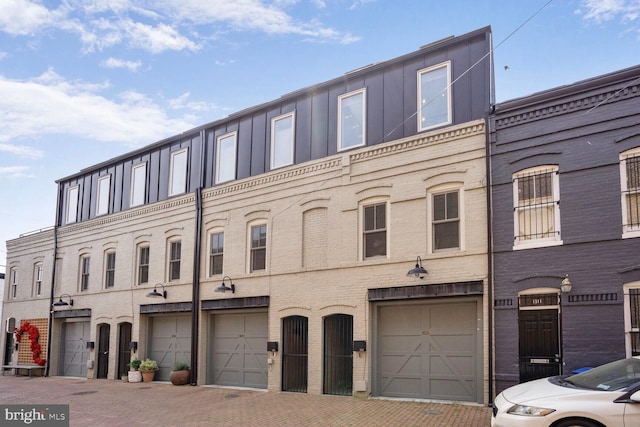 townhome / multi-family property featuring an attached garage and driveway