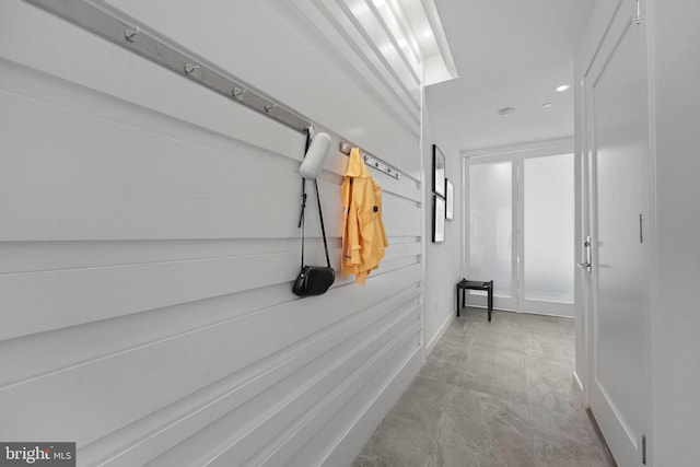 hall featuring baseboards