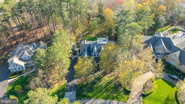 aerial view featuring a view of trees and a residential view