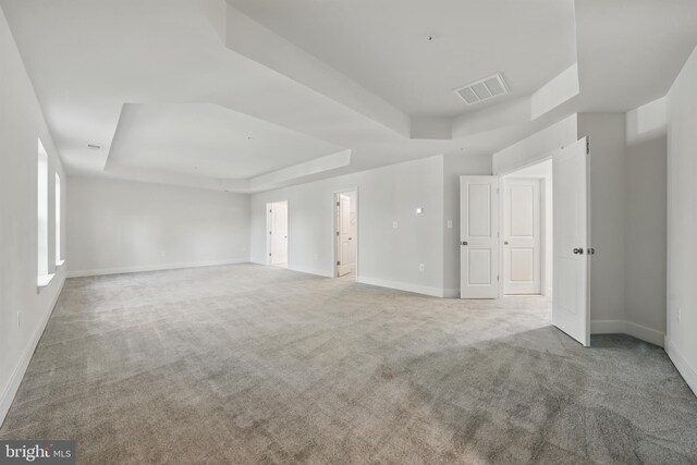 8504 Wendy St, Clinton, MD 20735 - unfurnished room featuring a tray ceiling, carpet flooring, and baseboards