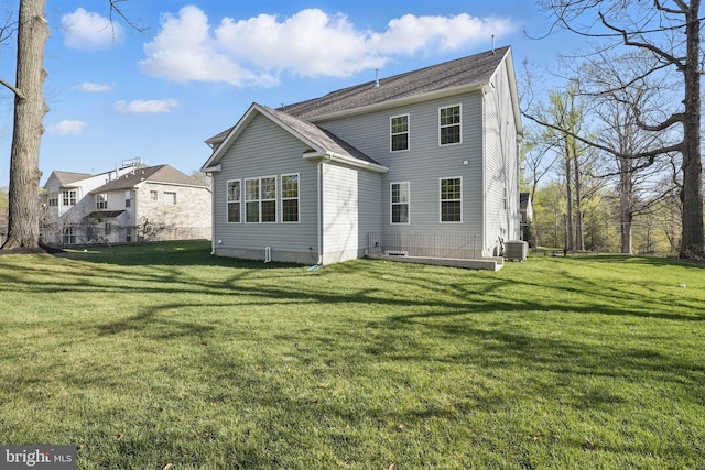 8504 Wendy St, Clinton, MD 20735 - back of house with a lawn and central air condition unit