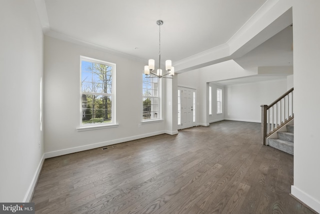 8504 Wendy St, Clinton, MD 20735 - unfurnished dining area featuring healthy amount of natural light, a chandelier, dark wood-style flooring, and crown molding