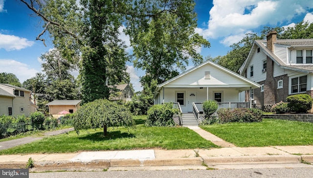 603 Hillcrest Ave, Wilmington, DE 19809 - bungalow-style house with covered porch and a front lawn