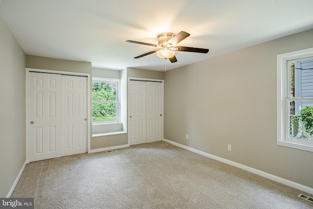 603 Hillcrest Ave, Wilmington, DE 19809 - unfurnished bedroom with two closets, carpet flooring, and a ceiling fan