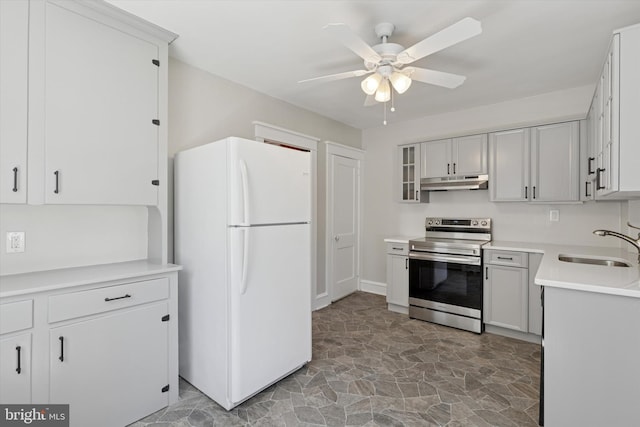 33 S Brighton Ave, Upper Darby, PA 19082 - kitchen featuring freestanding refrigerator, a ceiling fan, electric stove, under cabinet range hood, and a sink