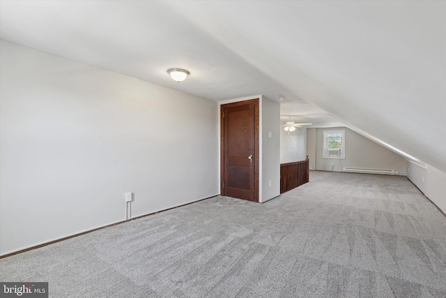 33 S Brighton Ave, Upper Darby, PA 19082 - additional living space featuring vaulted ceiling, light carpet, and a baseboard radiator