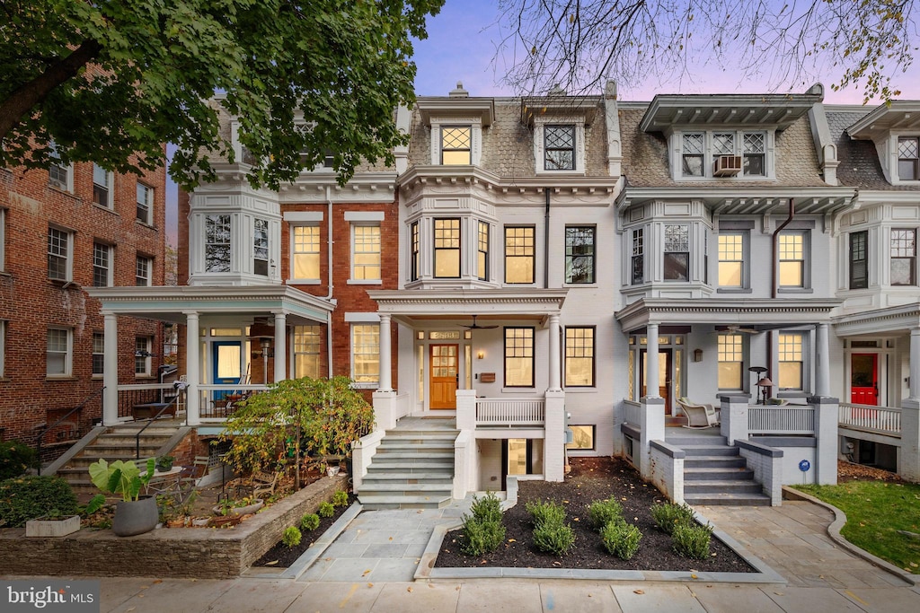 2833 27th St NW, Washington, DC 20008 - view of property featuring roof with shingles, mansard roof, and covered porch