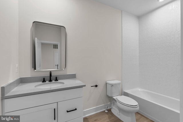 43290 Farringdon Sq, Broadlands, VA 20148 - bathroom with toilet, wood finished floors, vanity, baseboards, and  shower combination