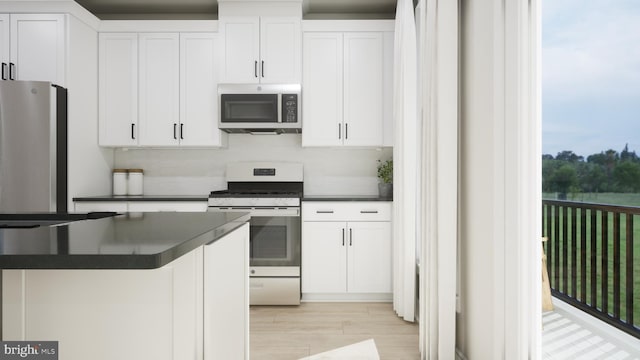 43290 Farringdon Sq, Broadlands, VA 20148 - kitchen with appliances with stainless steel finishes, dark countertops, and white cabinetry