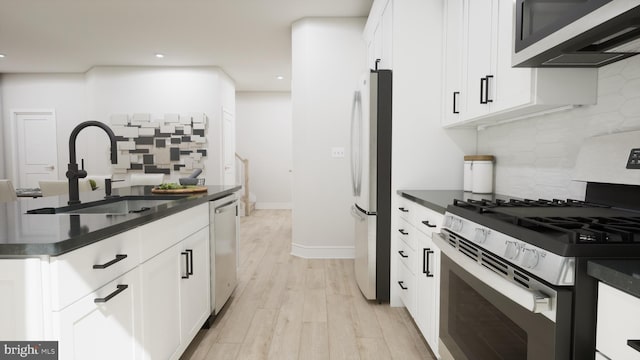 43290 Farringdon Sq, Broadlands, VA 20148 - kitchen with appliances with stainless steel finishes, a sink, dark countertops, and recessed lighting