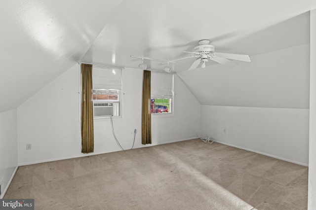 bonus room featuring cooling unit, a ceiling fan, carpet floors, lofted ceiling, and baseboards