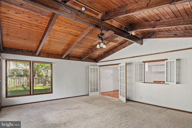 carpeted empty room with a ceiling fan, wooden ceiling, vaulted ceiling with beams, french doors, and baseboards