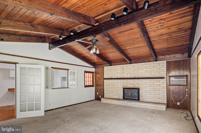 unfurnished living room featuring lofted ceiling with beams, a ceiling fan, wood ceiling, a wall mounted AC, and carpet flooring