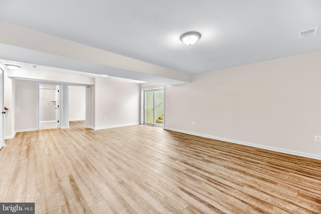 interior space with visible vents, baseboards, and light wood-type flooring