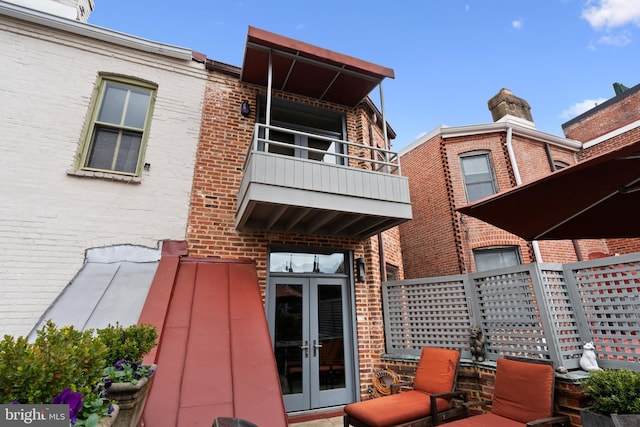 1910 Biltmore St NW Unit 2, Washington, DC 20009 - back of house with french doors, brick siding, and a balcony