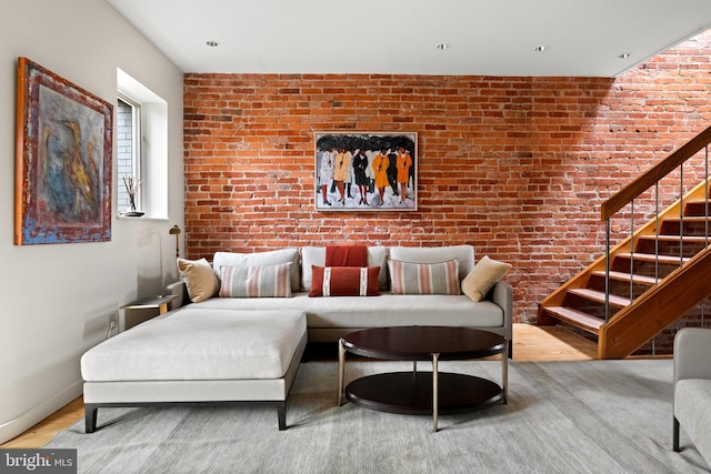 1910 Biltmore St NW Unit 2, Washington, DC 20009 - living room with stairway, brick wall, and wood finished floors