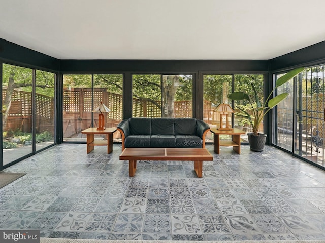 sunroom with an outdoor living space