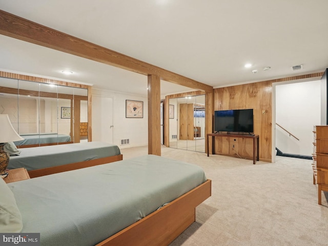 bedroom featuring visible vents, wood walls, carpet, and recessed lighting