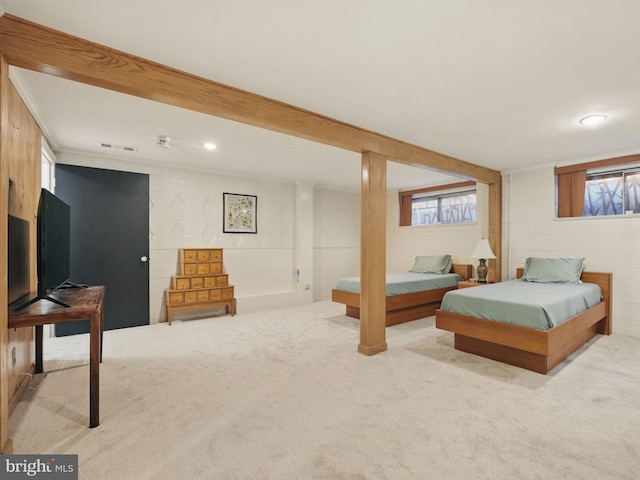 bedroom with recessed lighting, carpet flooring, and concrete block wall