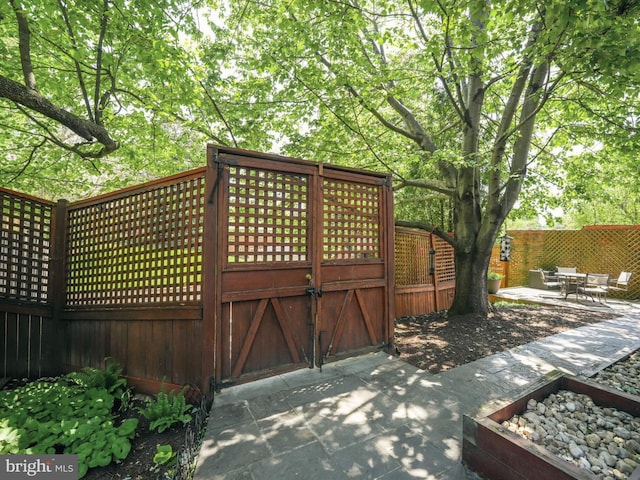 view of gate with fence