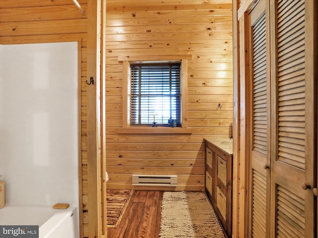 125 Rural Retreat Ln, Great Cacapon, WV 25422 - full bath with wood walls, wood finished floors, a tub to relax in, and vanity