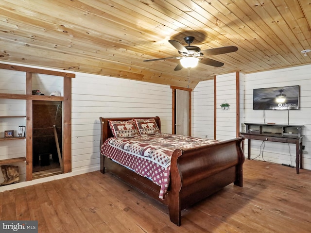 125 Rural Retreat Ln, Great Cacapon, WV 25422 - bedroom featuring wooden ceiling, hardwood / wood-style floors, wooden walls, lofted ceiling, and ceiling fan