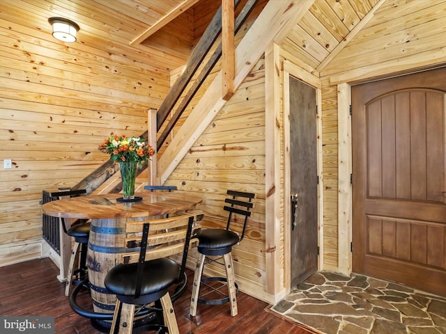 125 Rural Retreat Ln, Great Cacapon, WV 25422 - dining area featuring wooden walls, wooden ceiling, dark wood-type flooring, and lofted ceiling