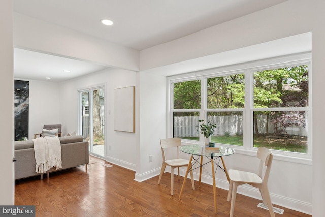 dining area featuring recessed lighting, wood finished floors, visible vents, and baseboards