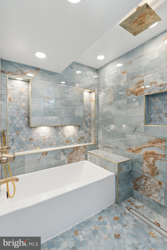 bathroom featuring a bath and recessed lighting