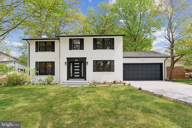 contemporary home with a garage, driveway, a front lawn, and brick siding