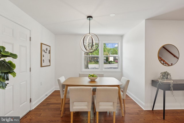 dining space with baseboards and dark wood-style floors