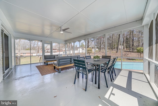 sunroom / solarium featuring outdoor lounge area, ceiling fan, and a wealth of natural light