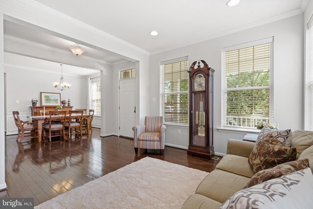 42364 Winsbury W Pl, Sterling, VA 20166 - living area with dark wood-style floors, a chandelier, ornamental molding, recessed lighting, and baseboards