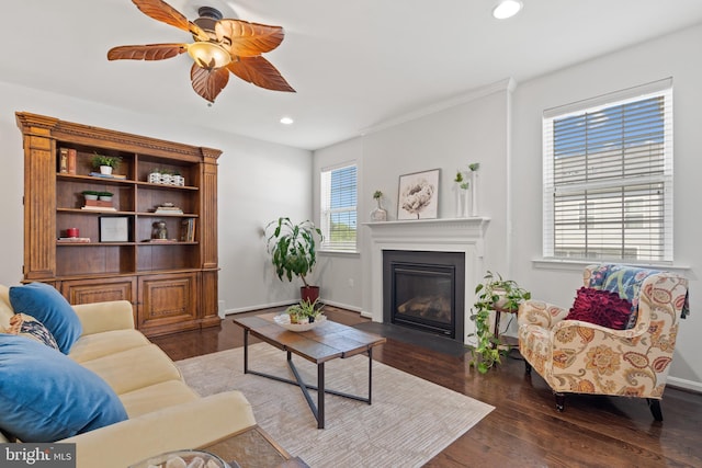 42364 Winsbury W Pl, Sterling, VA 20166 - living area with ceiling fan, recessed lighting, a glass covered fireplace, wood finished floors, and baseboards