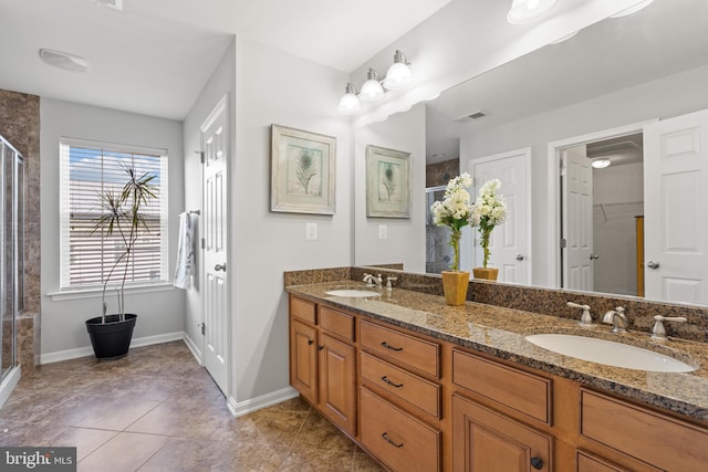 42364 Winsbury W Pl, Sterling, VA 20166 - bathroom featuring a shower stall, double vanity, baseboards, and tile patterned floors
