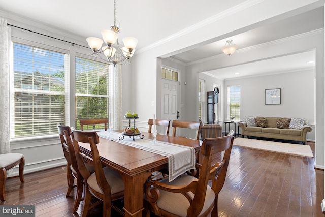 42364 Winsbury W Pl, Sterling, VA 20166 - dining room with dark wood-type flooring, a chandelier, ornamental molding, and baseboards