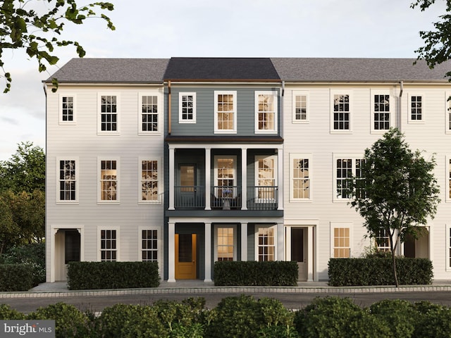 view of front facade with a balcony