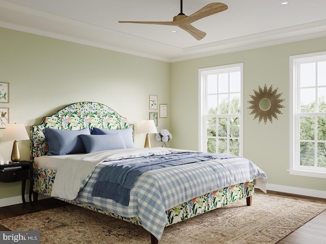 bedroom featuring recessed lighting, baseboards, multiple windows, and wood finished floors