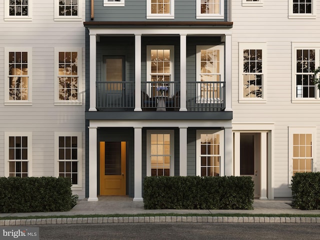 view of front of property with a balcony