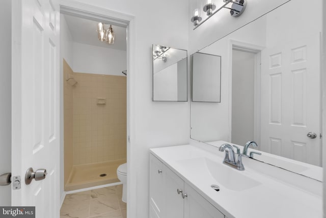 full bath with vanity, a shower stall, toilet, and marble finish floor
