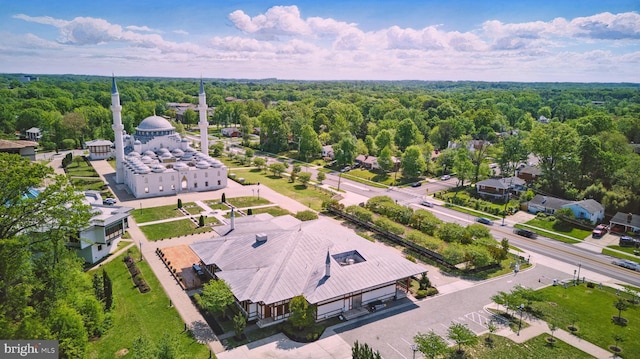 drone / aerial view featuring a view of trees
