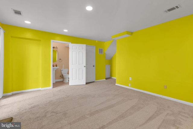 unfurnished bedroom with baseboards, carpet flooring, and visible vents