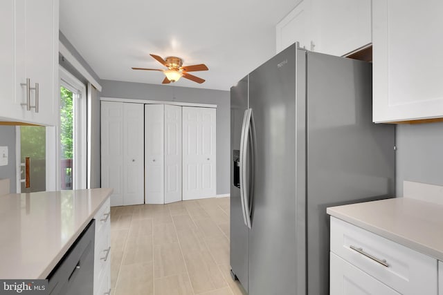 kitchen with white cabinets, stainless steel refrigerator with ice dispenser, ceiling fan, and light countertops