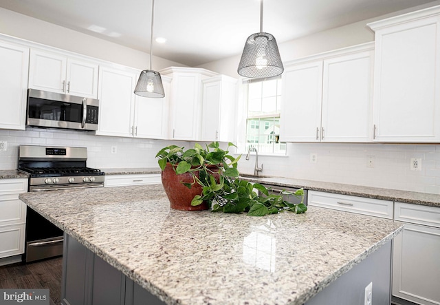 1218 Up And Over Ln, Aberdeen, MD 21001 - kitchen with white cabinetry, a kitchen island, and appliances with stainless steel finishes