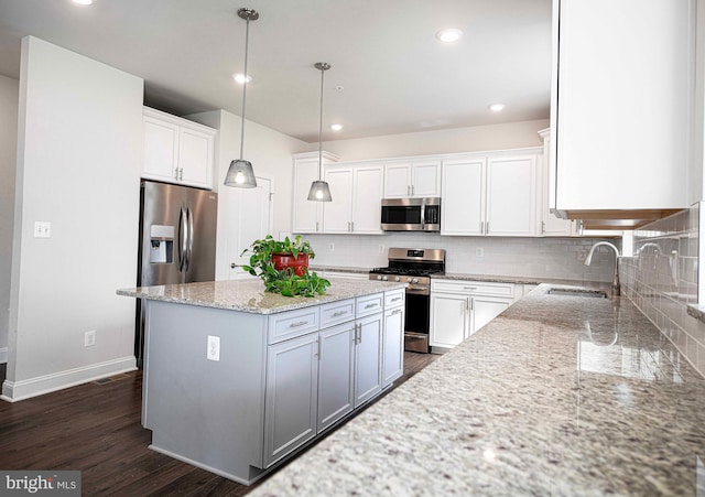 1218 Up And Over Ln, Aberdeen, MD 21001 - kitchen with a sink, stainless steel appliances, light stone counters, backsplash, and a center island