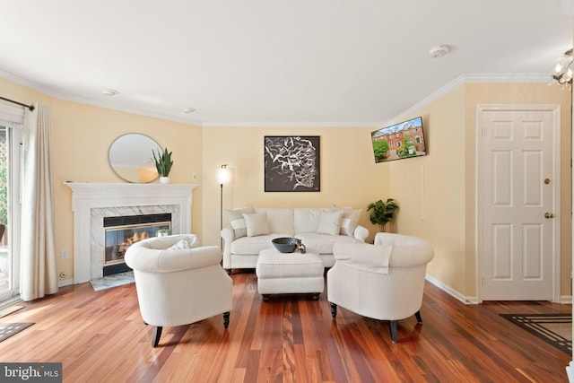 12015 Johns Pl, Fairfax, VA 22033 - living room with wood finished floors, a high end fireplace, crown molding, and baseboards