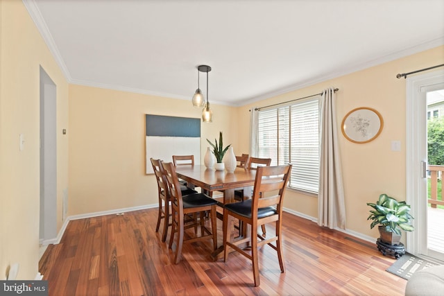 12015 Johns Pl, Fairfax, VA 22033 - dining area featuring wood finished floors, baseboards, and crown molding