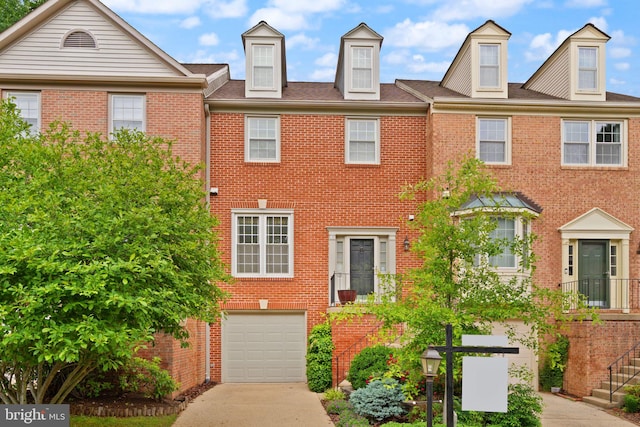 12015 Johns Pl, Fairfax, VA 22033 - multi unit property with driveway, a garage, and brick siding