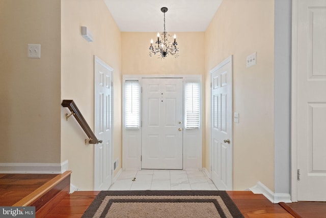 12015 Johns Pl, Fairfax, VA 22033 - foyer featuring a chandelier, baseboards, and light marble finish floors