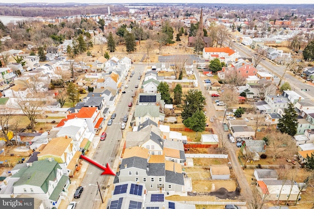 birds eye view of property with a residential view